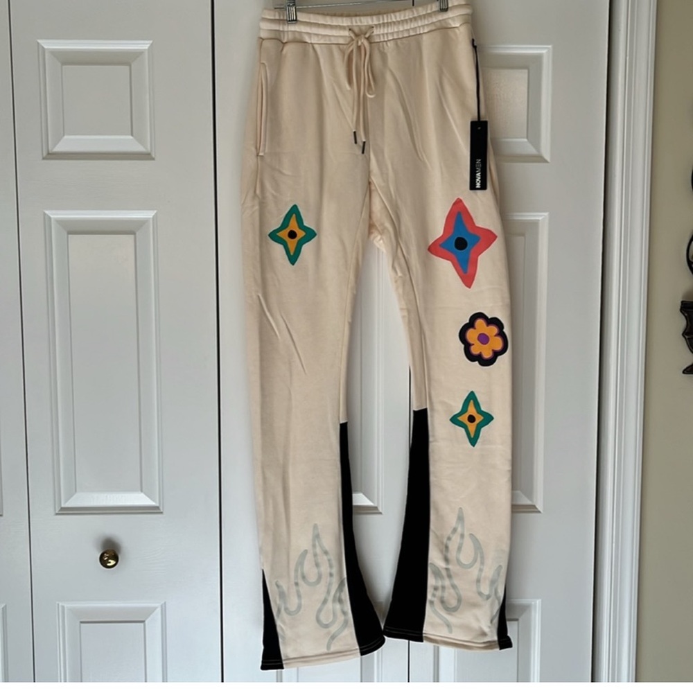 Nova Men ivory sweatpants with cool designs NWT